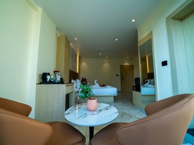 Guest room sitting area at Emerald Signature, Mysuru