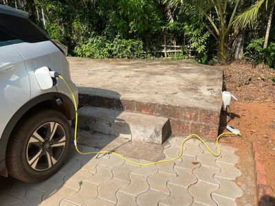 Guest EV charging using an outdoor wall socket at Areca County Honnavar